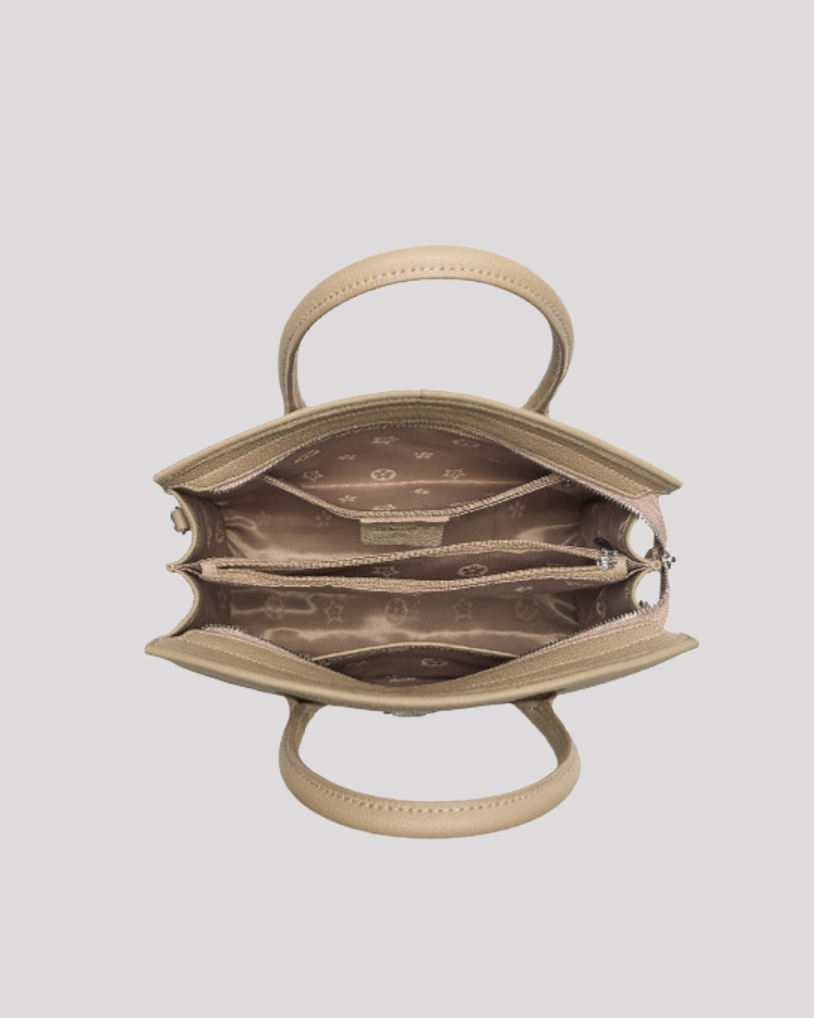 Top open view of beige croc-embossed leather handbag showing organized interior compartments