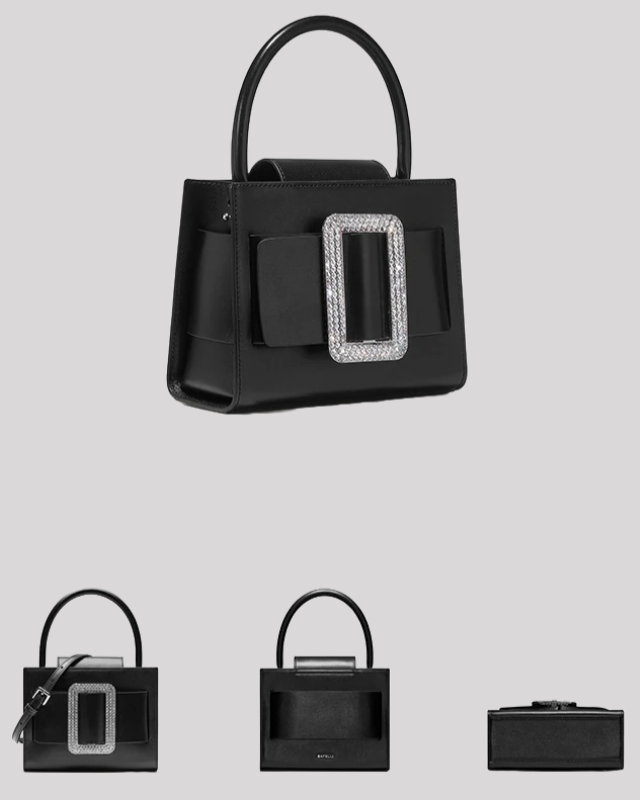 Angled view of black leather handbag by Bafelli featuring top handle and crystal buckle detail