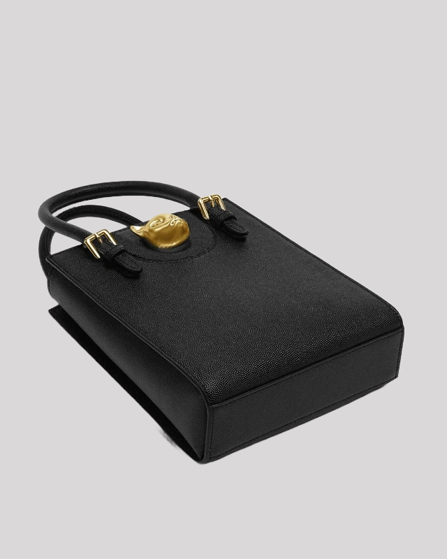 Bottom view of black tote bag by Bafelli laid flat, highlighting textured leather and sturdy construction
