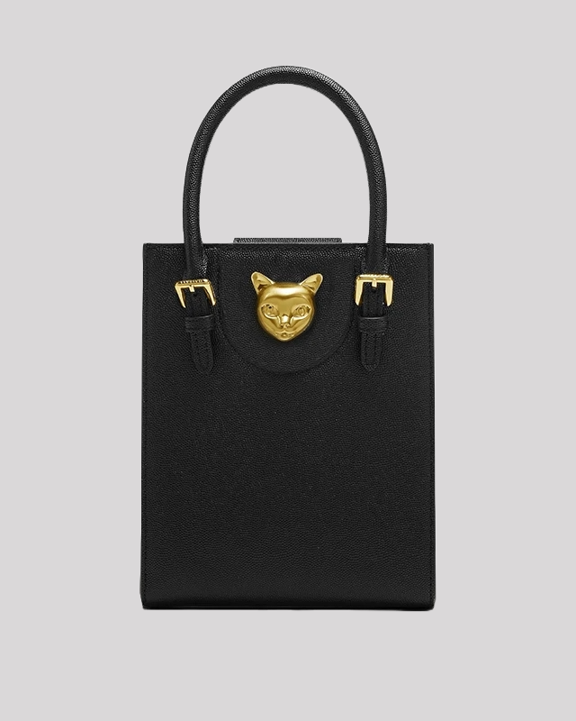 Front view of black tote bag by Bafelli in structured leather with gold cat head detail and dual handles
