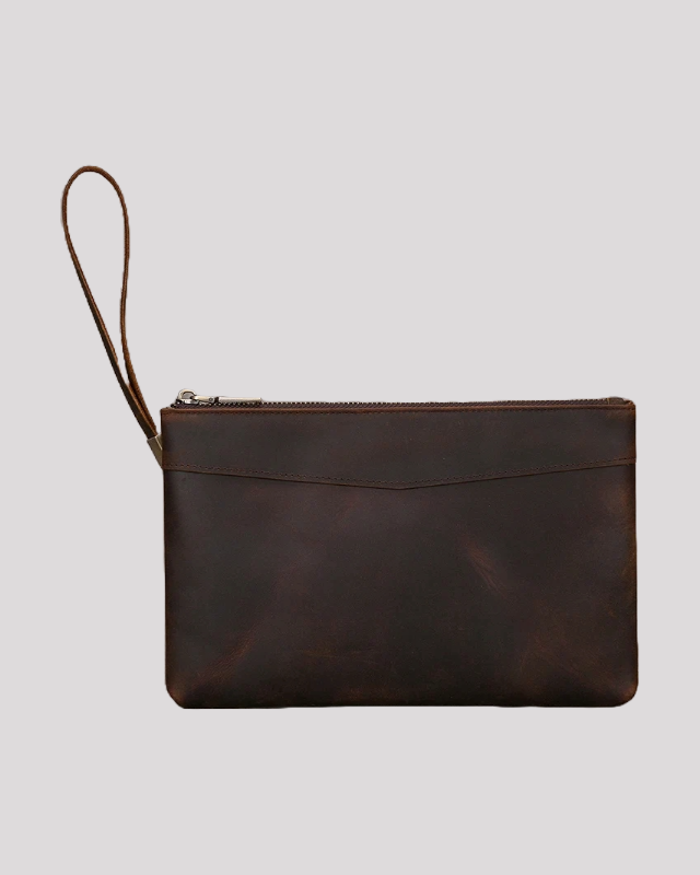 Dark brown leather clutch bag with wrist strap – front view