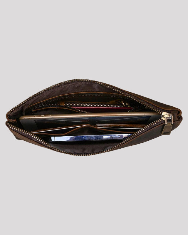 Top interior view of dark brown leather clutch bag with multiple compartments