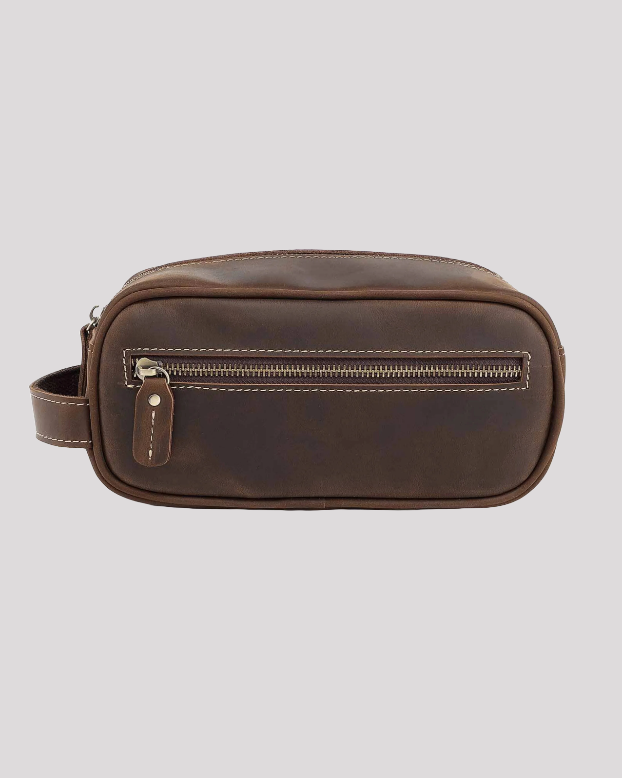Front view of dark brown leather toiletry bag with visible stitching and zipper closure