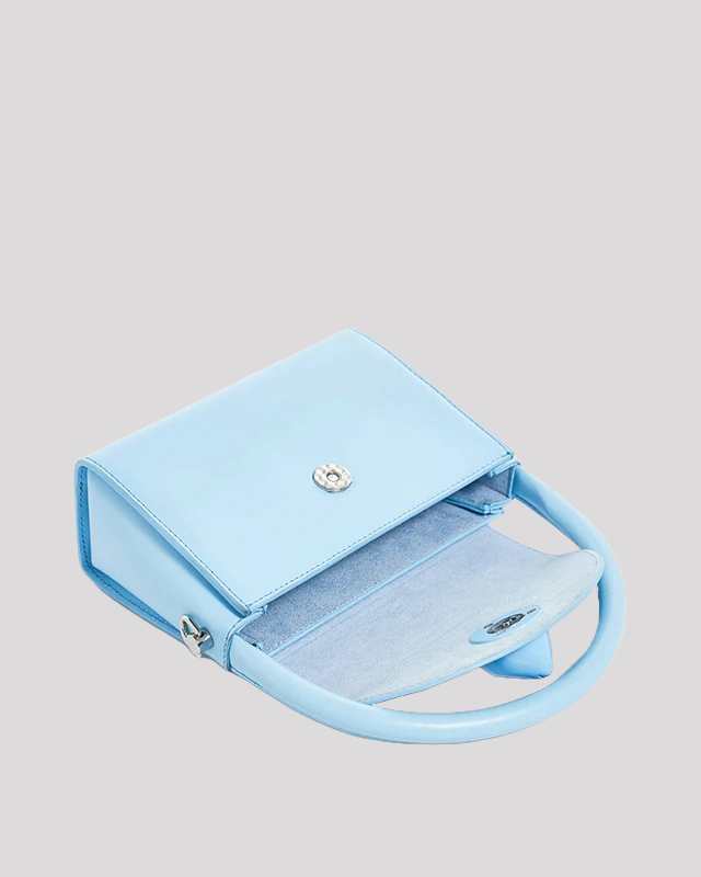 Open light blue cat handbag by Bafelli showing spacious interior with flap and snap closure
