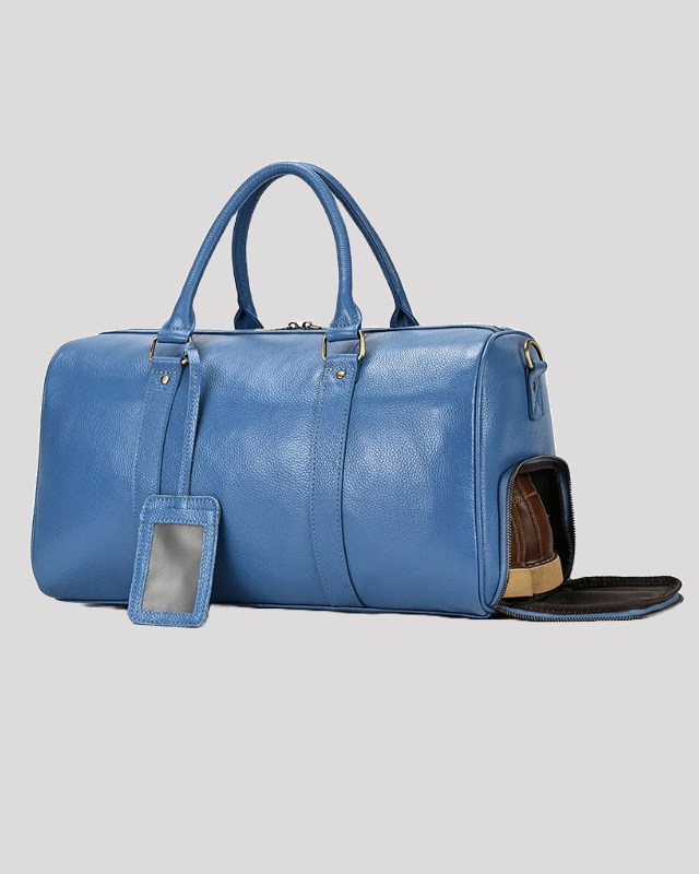 Men’s blue leather travel duffle bag – side shoe compartment open with shoes inside