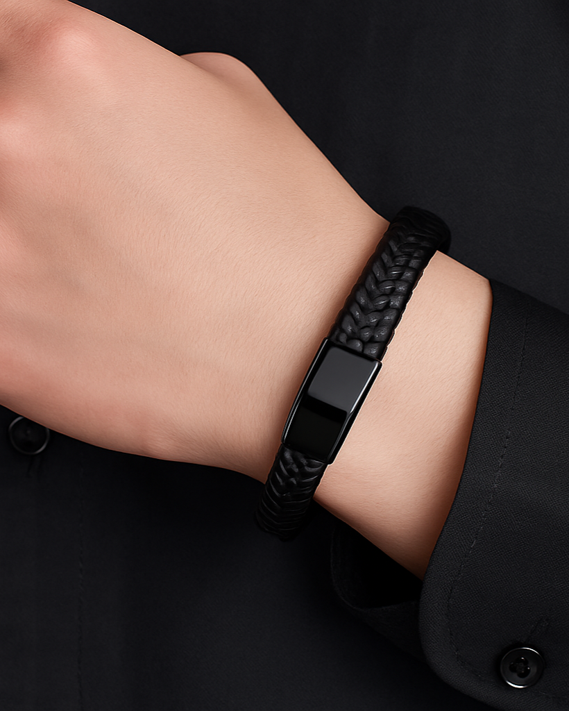 Men’s black braided leather bracelet on wrist – elegant and modern accessory