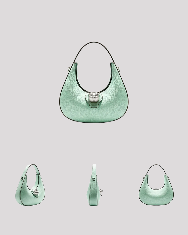 Multi-angle view of mint green leather shoulder bag by Bafelli with cat clasp and curved silhouette