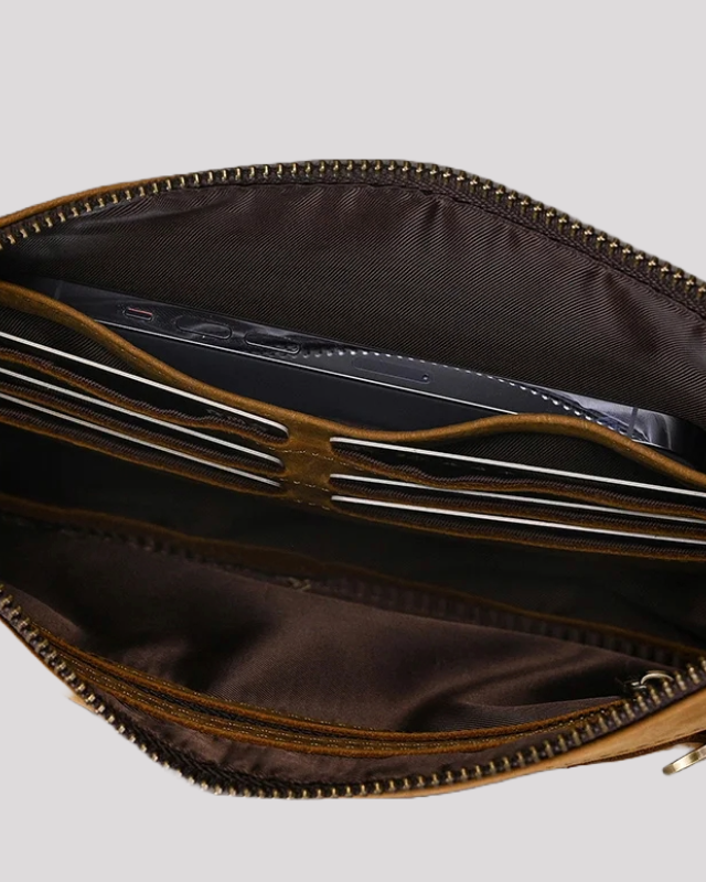 Close-up of mocha leather clutch bag interior – card slots and phone pocket