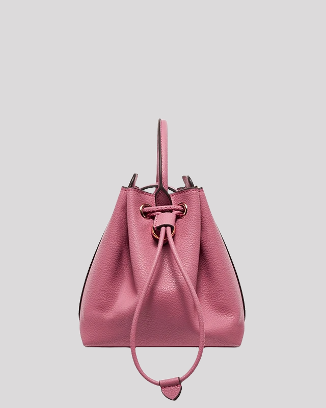 Side profile of pink mini bucket bag by Bafelli with drawstring closure and structured silhouette