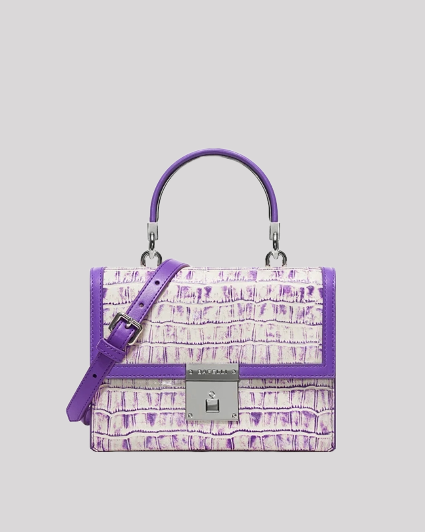 Front view of purple croc-embossed structured handbag by Bafelli with silver clasp and top handle