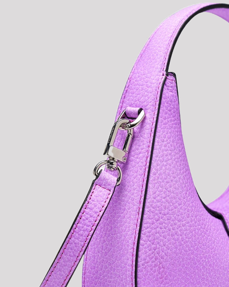Close-up of detachable strap and silver hardware on purple leather hobo bag by Bafelli