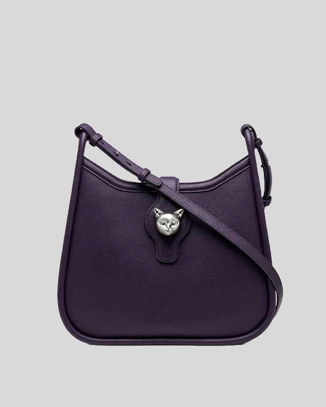 Front view of purple leather shoulder bag by Bafelli with silver cat head clasp and adjustable strap