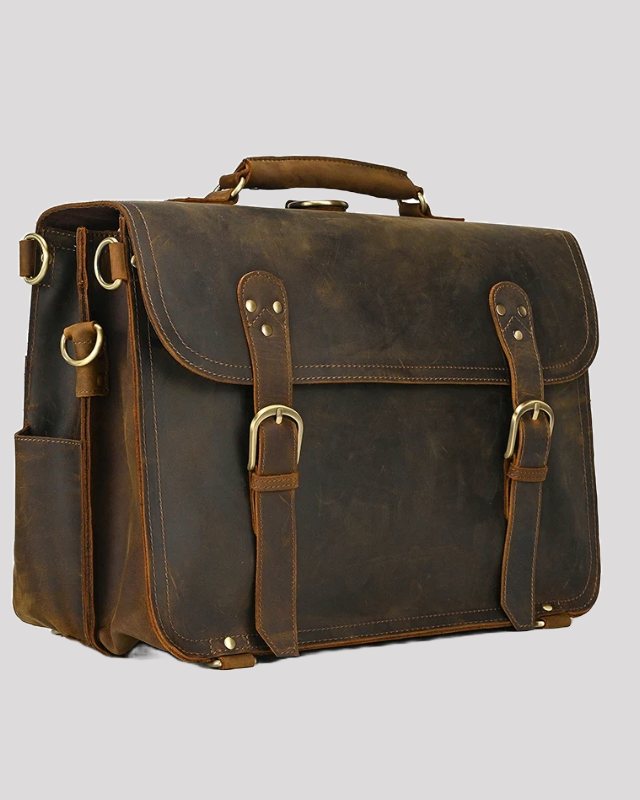 Vintage brown leather messenger bag with buckles – side angle view