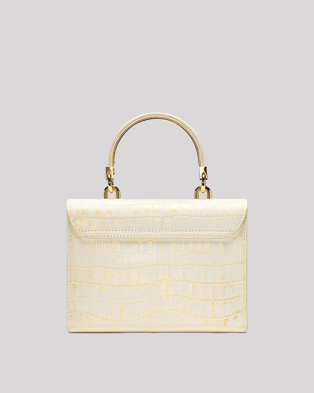 Back view of white croc-embossed top handle bag by Bafelli with smooth textured leather and structured edges