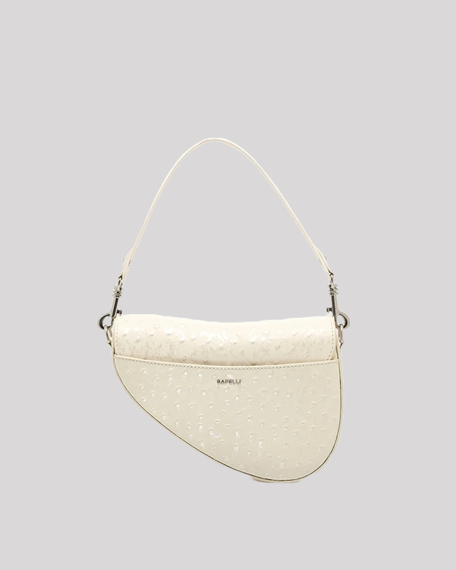 Back view of white ostrich-embossed asymmetric shoulder bag by Bafelli with subtle logo detail