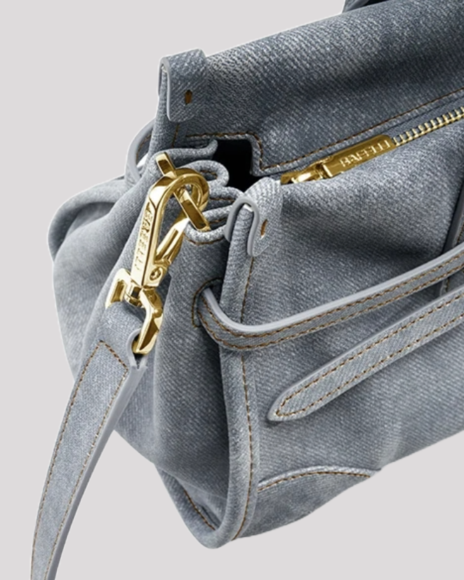 Women’s blue leather tote bag by Bafelli – close-up of zipper and gold clasp details
