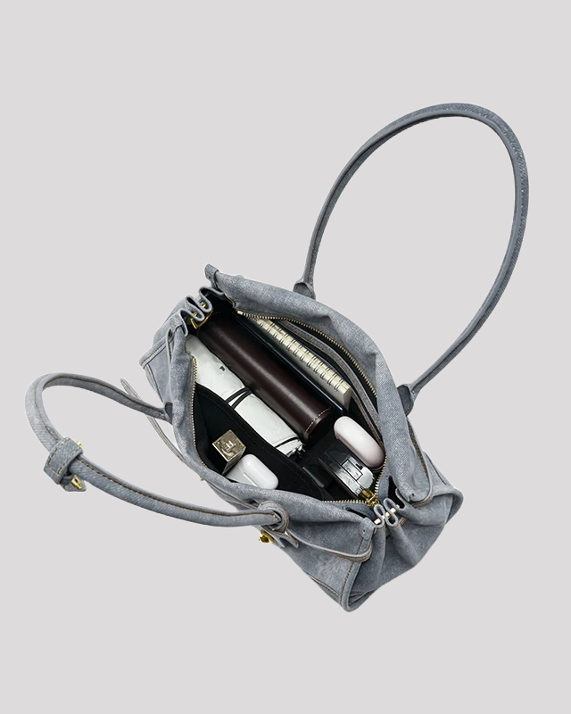 Open top view of women’s blue leather tote bag by Bafelli – spacious interior with accessories