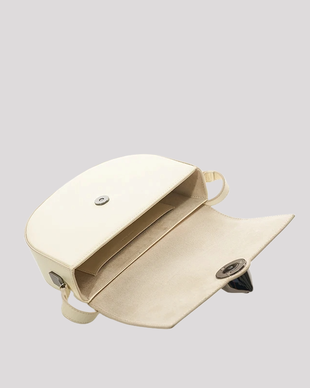 Women’s crossbody bag by Bafelli in white leather – spacious interior view with cat head clasp open