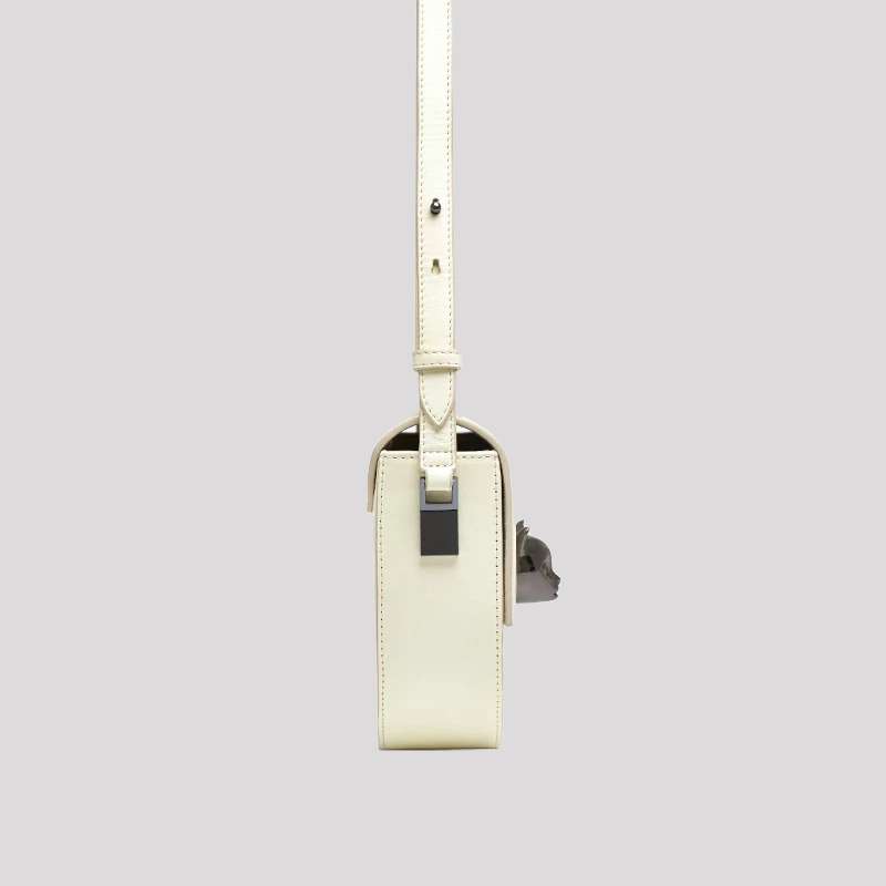 Women’s crossbody bag by Bafelli in white leather – side view with adjustable strap and cat head clasp