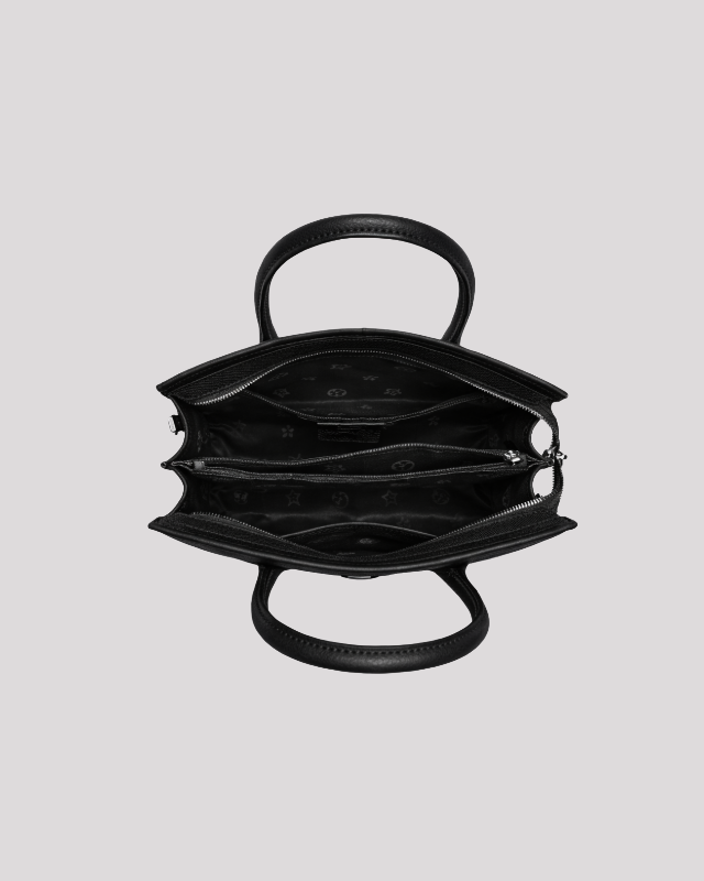 Top open view of black croc-embossed leather handbag showing organized interior compartments