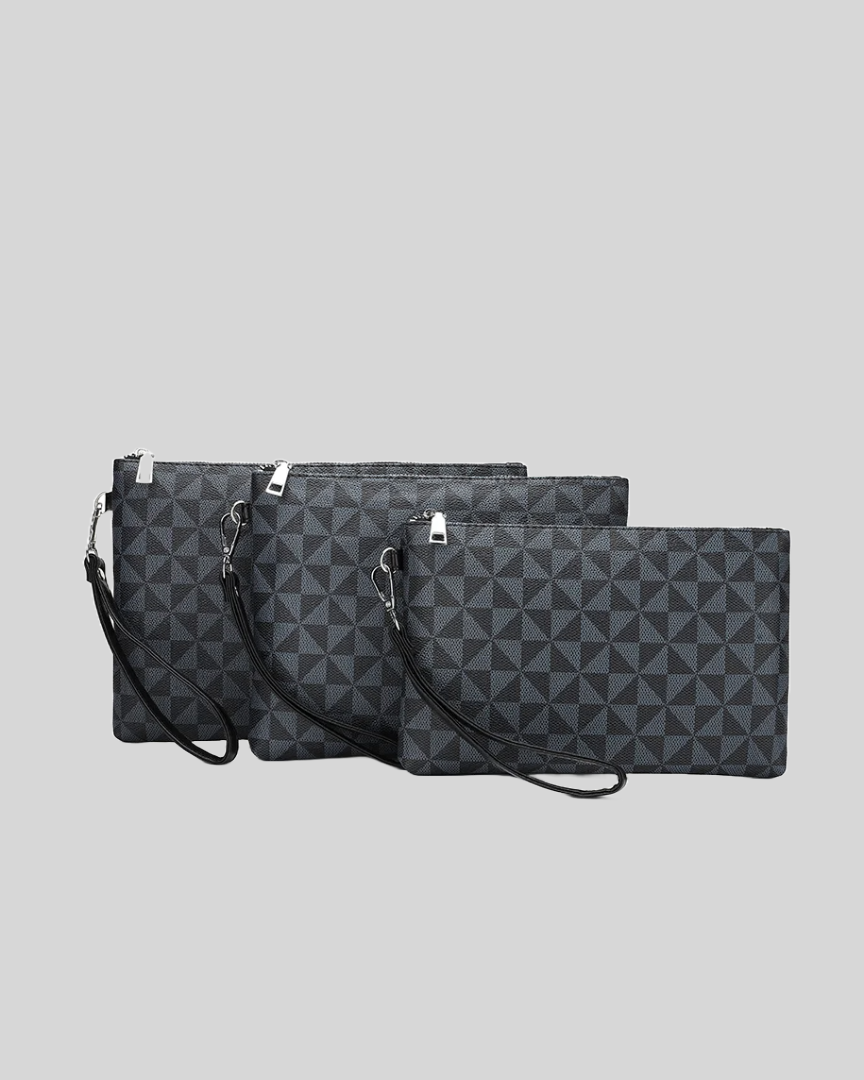 Set of three black wristlet pouches in different sizes with geometric pattern and detachable strap