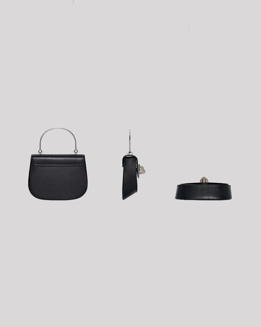 Back view of black leather handbag by Bafelli with smooth finish and top handle in silver