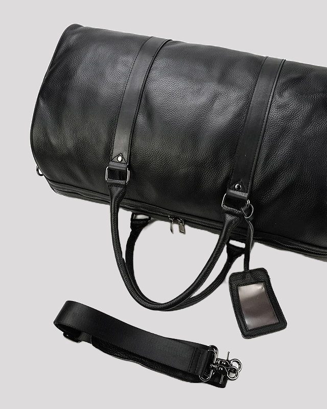 Black leather travel duffel bag with detachable and adjustable strap