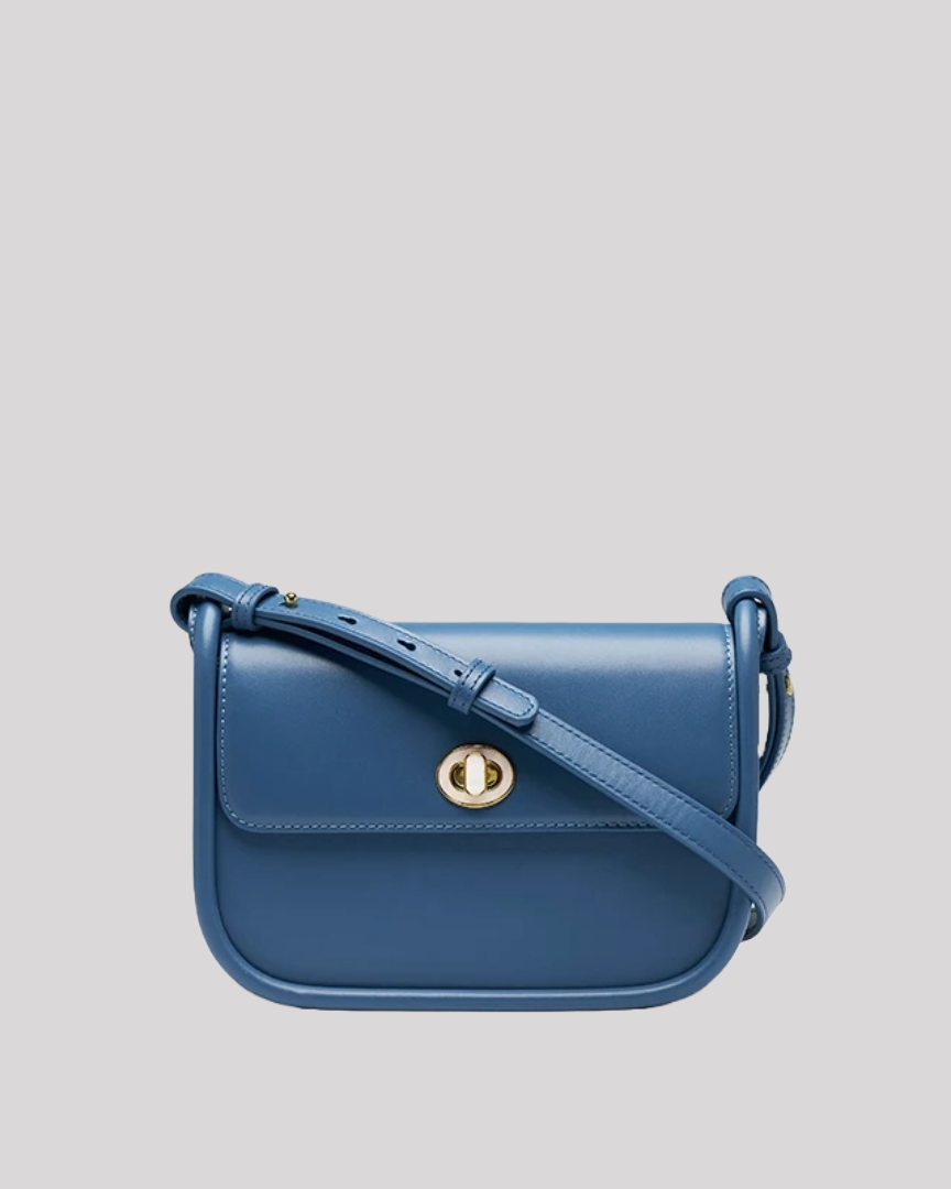 Front view of structured blue leather shoulder bag by Bafelli with gold turn-lock closure and adjustable strap
