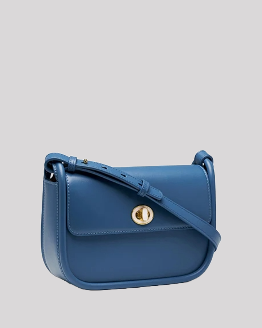 Side angle of elegant blue leather shoulder bag by Bafelli showing smooth finish and gold hardware