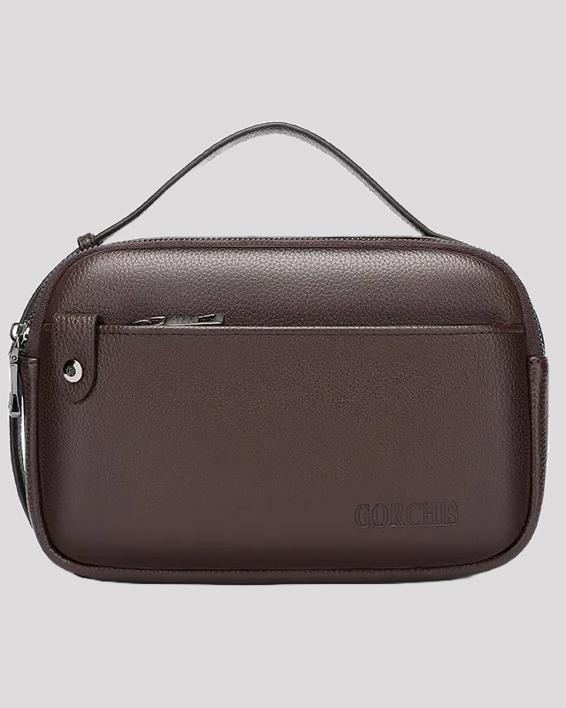 Front view of brown leather men’s handbag with top handle and zipper pocket