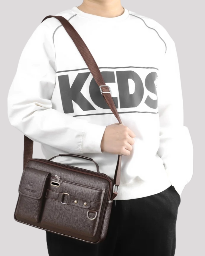 Man wearing brown leather messenger bag crossbody – casual outfit front view