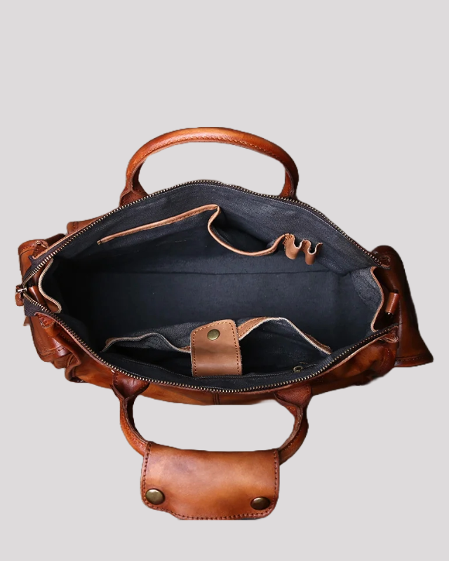 Interior view of brown vintage leather messenger bag with multiple compartments and dark lining