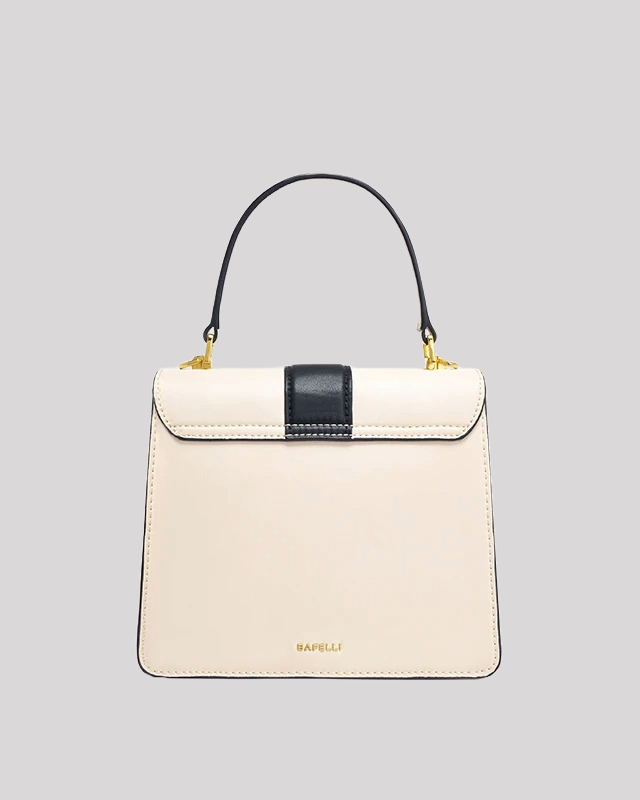 Back view of cream and black handle bag by Bafelli with black strap detail and gold embossed logo