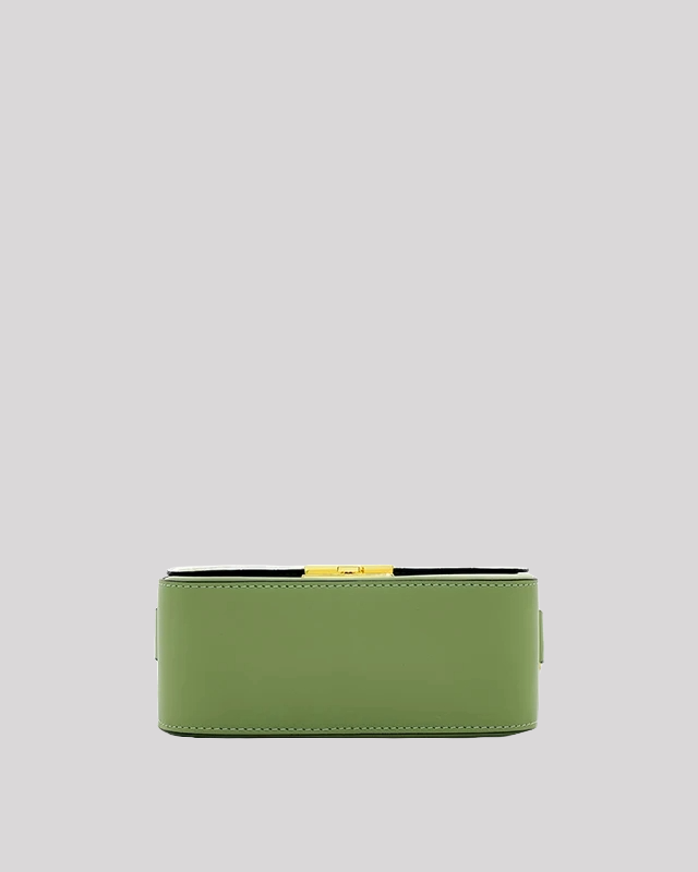 Bottom view of green croc-embossed shoulder bag by Bafelli with smooth stitching and flat base