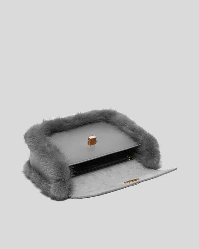 Interior view of grey fur-trim crossbody bag by Bafelli showing spacious compartment with soft lining