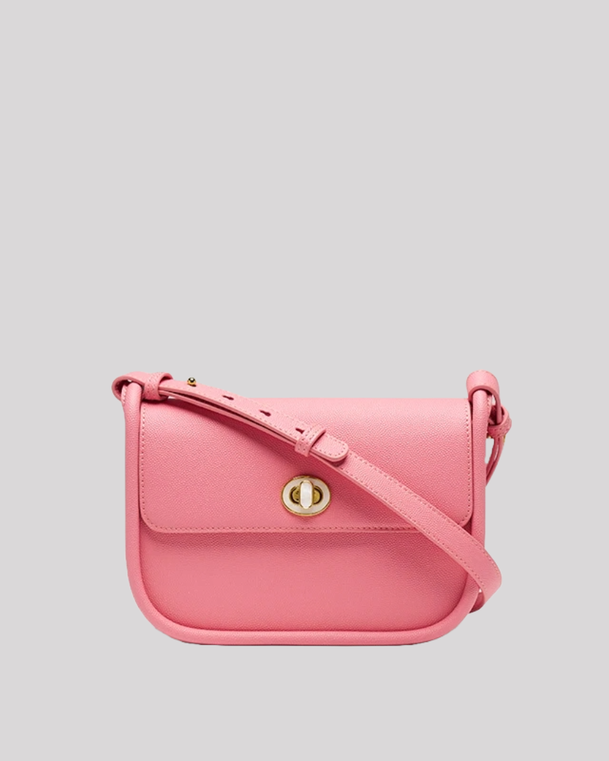 Front view of pink crossbody bag by Bafelli in smooth leather with gold turn-lock closure and slim adjustable strap