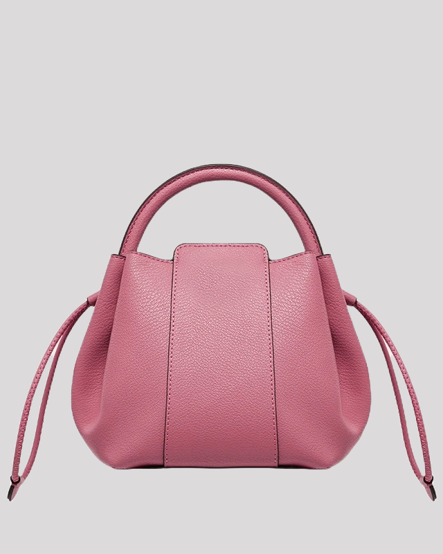 Back view of pink mini bucket bag by Bafelli with smooth textured leather and drawstring detail