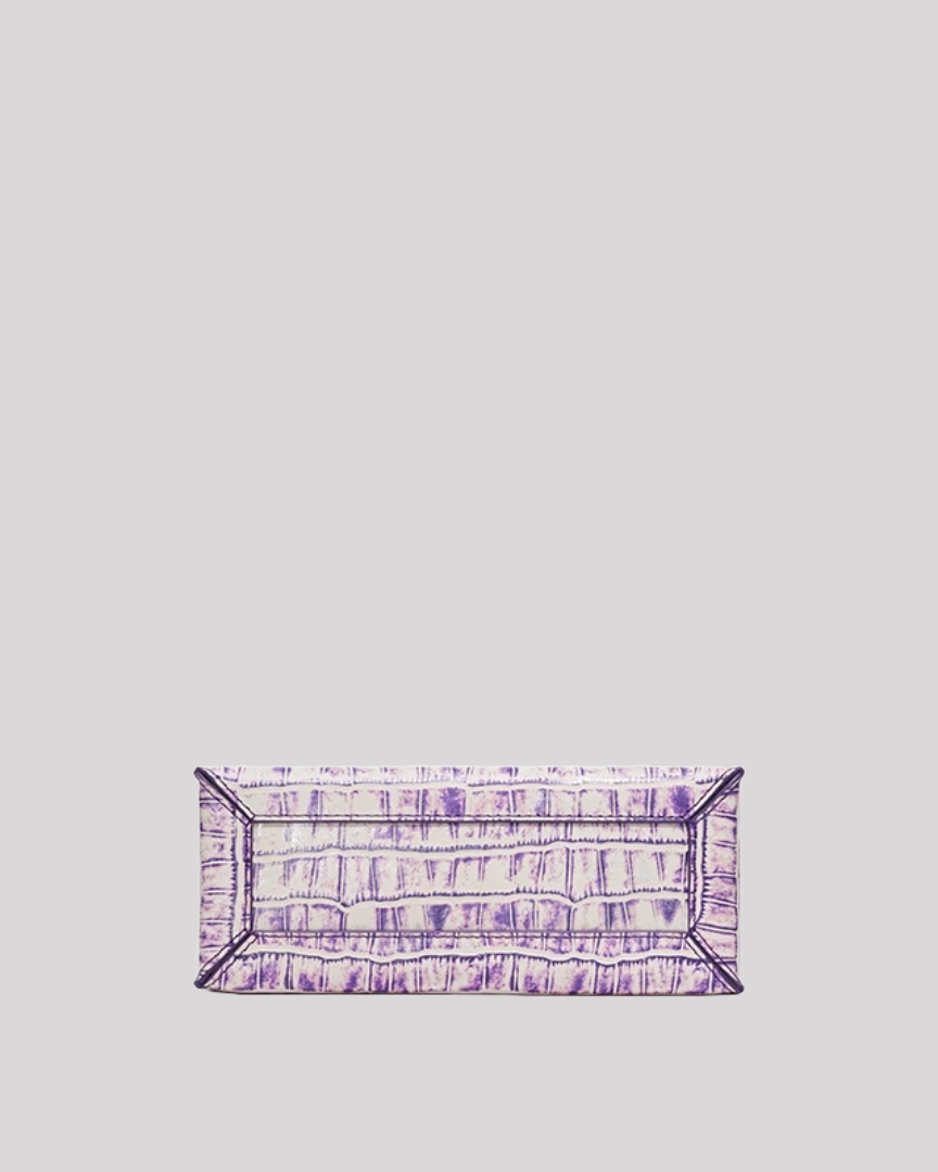 Bottom view of purple croc-embossed structured handbag by Bafelli with reinforced seams