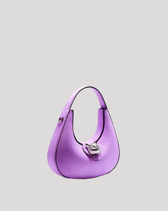 Side angle of purple leather hobo bag by Bafelli with structured silhouette and cat clasp detail