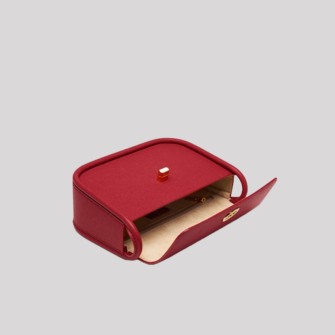 Inside view of red crossbody bag by Bafelli showing beige lining and inner zip pocket