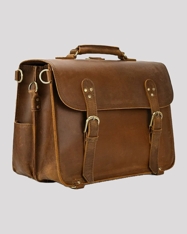 Vintage mocha leather messenger bag with double buckle straps – side angle view