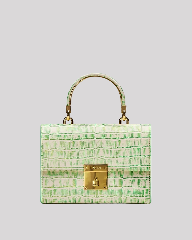 Front view of white and green croc-embossed top handle bag by Bafelli with gold lock closure and structured design