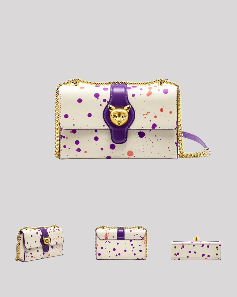 Multiple angle views of white paint-splatter shoulder bag with purple strap, gold-tone cat clasp, and chain strap by Bafelli