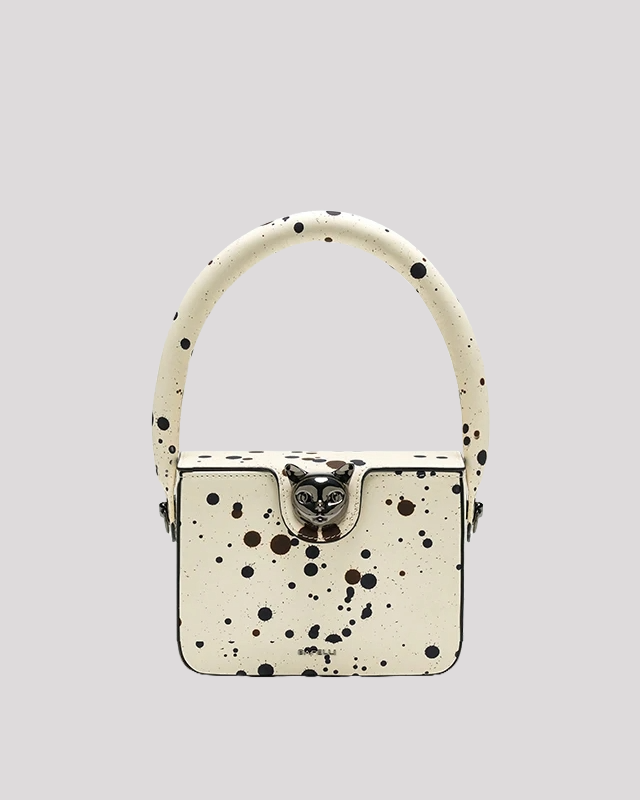 White box bag by Bafelli with black and brown paint splatter pattern – front view with round handle