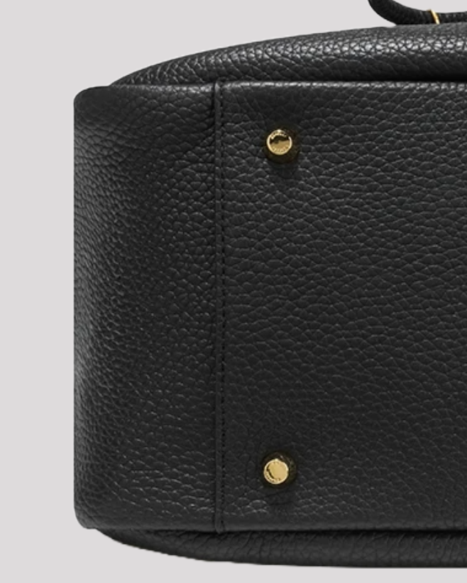 Women’s black leather bucket bag by Bafelli – bottom view with protective gold studs