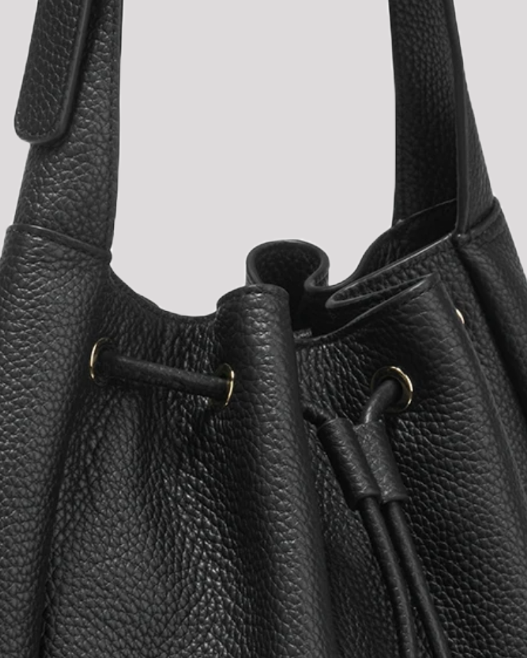 Women’s black leather bucket bag by Bafelli – close-up of drawstring closure and leather texture