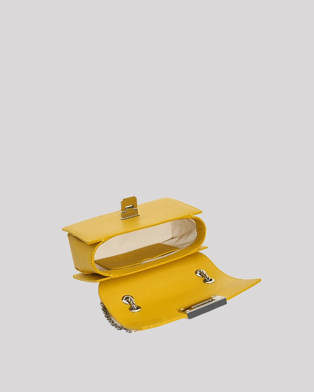 Inside view of yellow mini crossbody bag by Bafelli with flap open and light interior lining